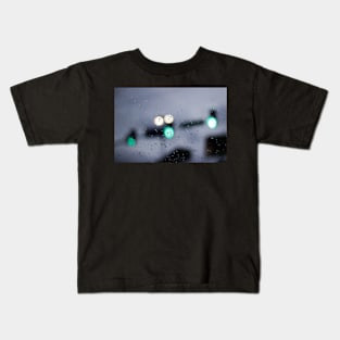 Urban traffic lights through wet glass Kids T-Shirt